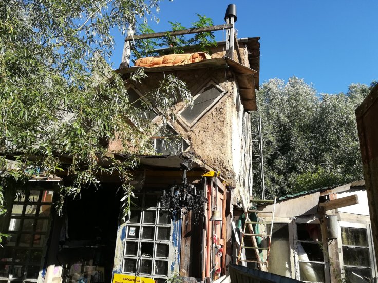  Visionary spaces, here a communal kitchen space and sleeping quarters made from earth and shipping containers 